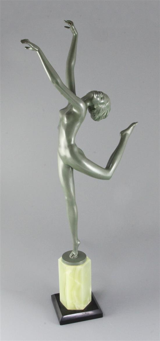 A green patinated bronze figure of a nude dancer in the style of Josef Lorenzl, H. 26in. overall